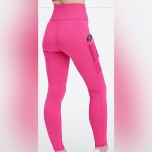 Bright neon pink Fabletics high waisted leggings